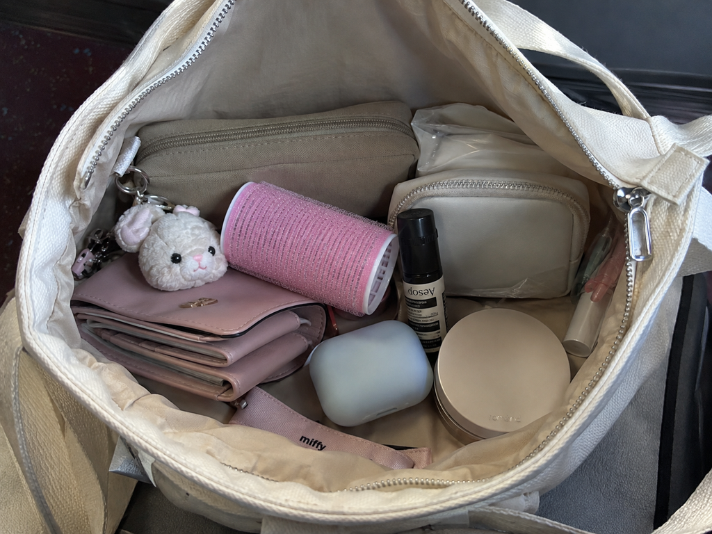 Hair roller carried inside a bag with everyday personal items