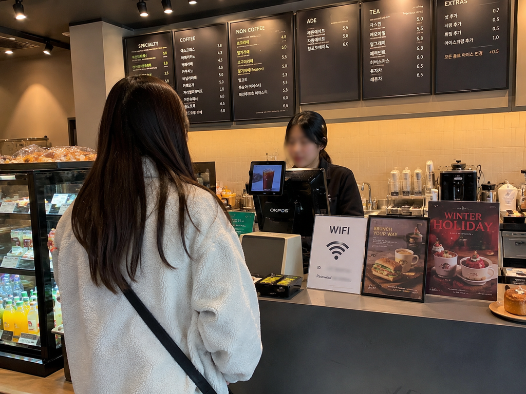 Customer ordering coffee at a cafe in Korea