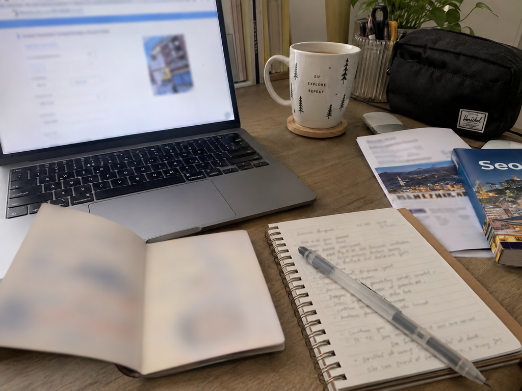 Passport beside a smartphone while completing an online travel authorization application