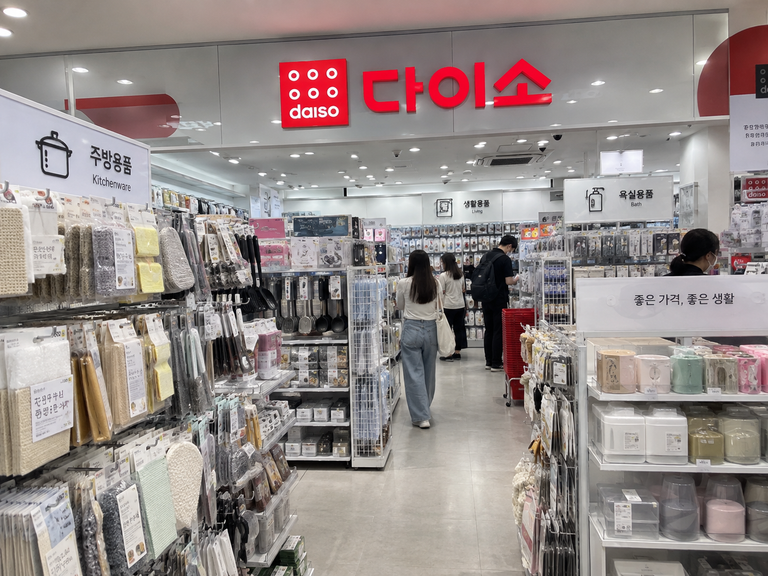 Inside a Daiso store in Korea with shelves of affordable everyday products